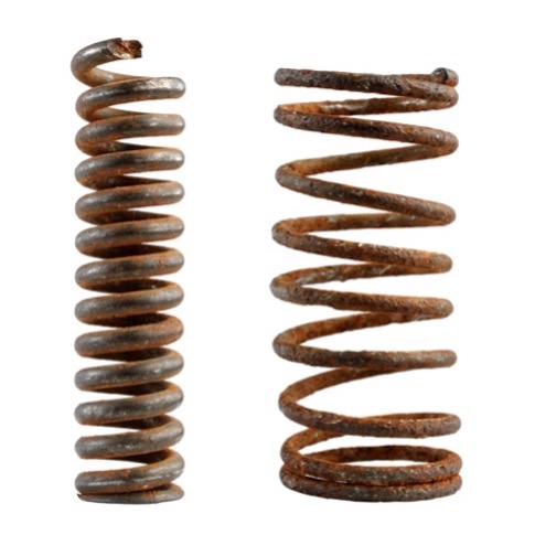 A close-up of a rusty spring